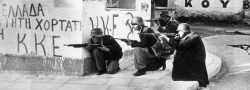 Greek-communist ELAS revolutionaries in Athens, wearing captured German helmets. On the walls is written KKE, the Greek Communist party.